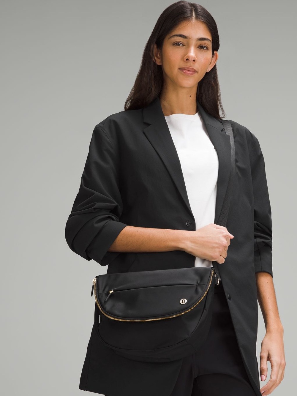 Lululemon 5L festival bag. Black Crossbody Shoulder Bag with Gold Accents